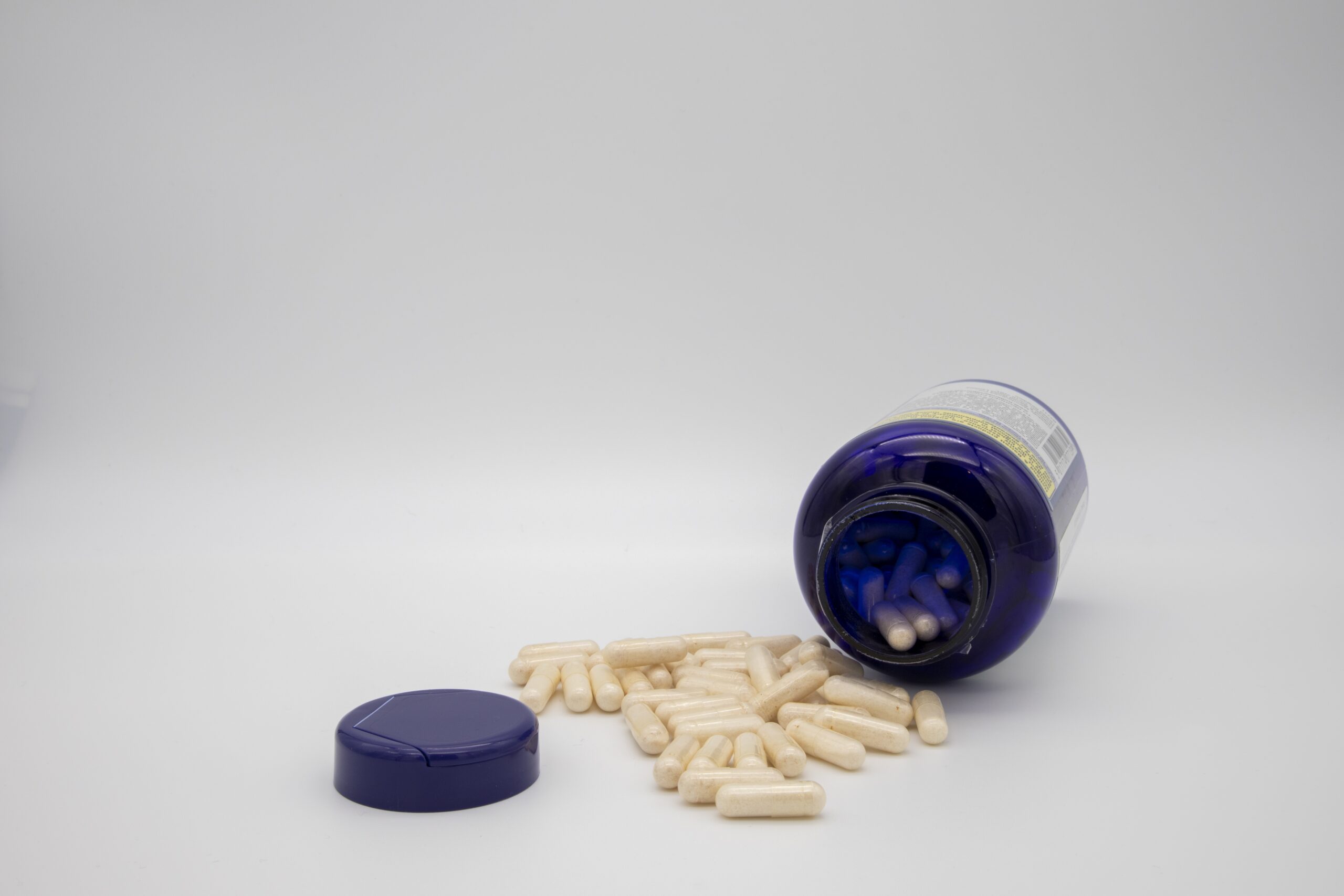 GLOUCESTER, UNITED KINGDOM - Jan 06, 2020: Medication in the form of capsules/pills/tablets against a white background